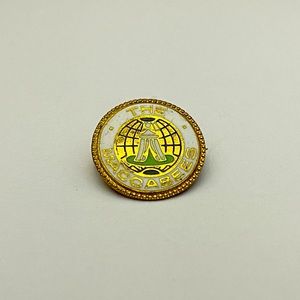 A vintage clasp lapel pin for “The Macabees”